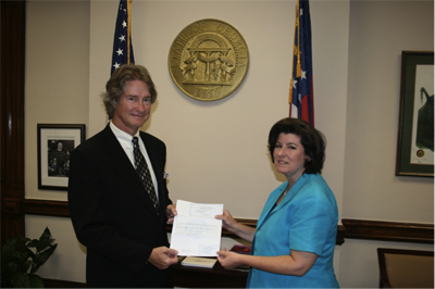 Bill Grady receives his builder�s license from Karen Handel, Georgia Secretary of State